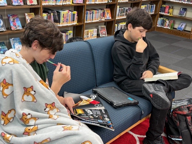 Students and educators celebrating a Joyful Reading fundraiser