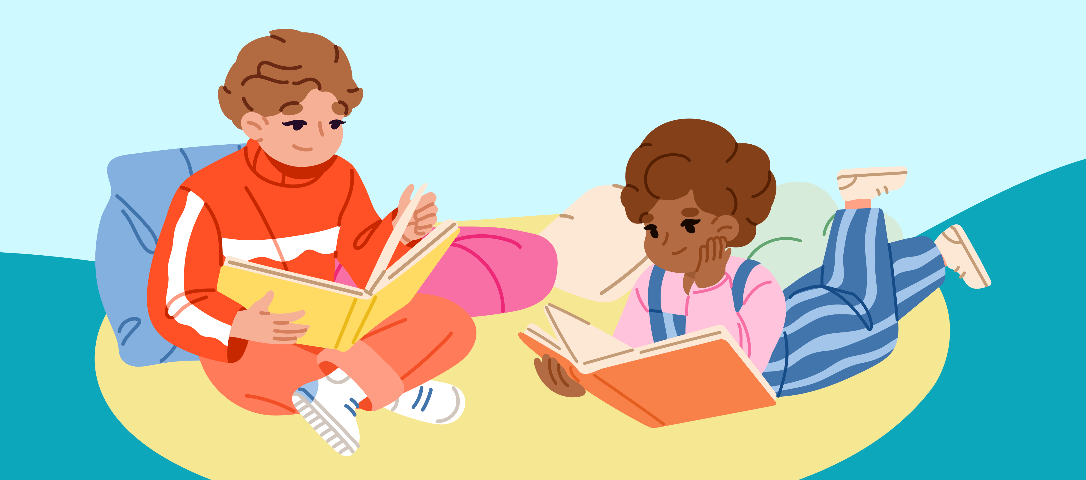 Two young children reading together